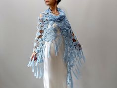 Light Blue Shawl MATERİAL: 100% pure cotton. COLOR: Blue as shown MEASUREMENTS: Length: 87'' ( 220cm) Width: 39'' (100cm) (without fringes) CARE INSTRUCTIONS: Hand washed or put in a delicate washing cycle of 40oC/104oF, or lower. İf you purchase 3 or more items please use ''BONUS'' as Coupon Code for 10% discount during the check out. More shawls and wraps in my shop: https://www.etsy.com/shop/Minnoshko?ref=l2-shopheader-name§ion_id=20621720 More handmade accessories and clothing in my shop: ht Bohemian Blue Shawl For Weddings, Blue Bohemian Shawl Wrap, Handmade Blue Shawl For The Beach, Blue Bohemian Shawl For Spring, Blue Handmade Beach Shawl, Blue Bohemian Shawl With Fringe, Crochet Summer Shawl, Crochet Summer Scarf, Evening Scarf