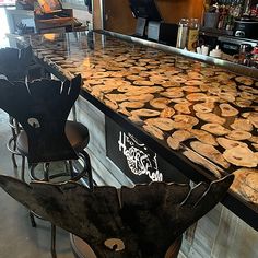 two chairs are sitting at the bar with pies on it's counter top