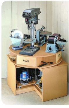 a sewing machine is sitting on top of a table with drawers and tools in it