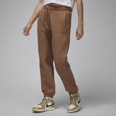 Supersoft fleece turns these roomy pants into a new casual fave. Plus, premium details like a stretchy waistband, metal-tipped drawcord and tonal patch will make you forget all about the other sweats in your drawer. Brown Athleisure Pants With Pockets, Sporty Brown Pants For Fall, Brown Athleisure Bottoms For Fall, Athleisure Brown Bottoms For Fall, Brown Sporty Bottoms For Loungewear, Comfortable Brown Sweatpants With Pockets, Casual Fall Sweatpants With Pockets, Fall Loungewear Sweatpants With Hip Pockets, Sporty Brown Joggers With Pockets