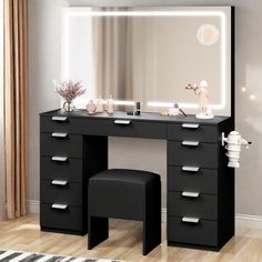 a black vanity with lighted mirror and stool