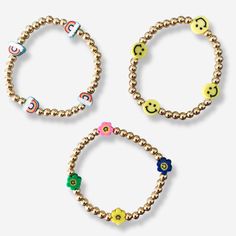 Our Yellow Smiley Bracelet features 5mm gold beading throughout with the happiest smiley accents. We can't help but smile when we see them! These would be a beautiful addition to one of our Custom Name Bracelets, Paper Clip Bracelet or even worn solo! Details:- 5mm Gold Plated Beading throughout - Yellow Smileys- Adult size stretches to fit most wrists approximately 6.5-7" in length Free U.S. Shipping on orders over $50!Your jewels will arrive in one of our suede gift pouches. Perfect for giftin Smiley Bracelet, Yellow Smiley Face, Pink Pouch, Brass Beads, Rainbow Bracelet, Rainbow Beads, Baby Hands, Stackable Bracelets, Name Bracelet