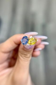 "DETAILS: * Handmade item * Gemstone: Diamond, Sapphire * Gem Size in Pictures: Sapphires Blue, Yellow 4.5 CTW Option * Band color: 14k Yellow Gold (may vary on gold selection) * Condition: Never been Used; Made to order, Recycled Metal, Conflict-free 100% DESCRIPTION: 💎 Welcome to the Our Shop, Congratulations🍾 on discovering us. 💎 The ring is a stunning piece with intricate detailing and unique piece. It features a blue and yellow oval sapphire set in 14k, one round and one pear diamond on Yellow Sapphire And Diamond Ring, Fine Yellow Oval Sapphire Ring, Oval Yellow Sapphire Ring With Center Stone, Oval Sapphire Gemstone With Multi-stone Detail, Oval Multi-stone Sapphire Gemstones, Yellow Oval Sapphire Ring With Prong Setting, Oval Sapphire Multi-stone Gemstones, Gold Oval Sapphire Ring With Multi-stones, Gold Multi-stone Sapphire Ring With Oval Shape