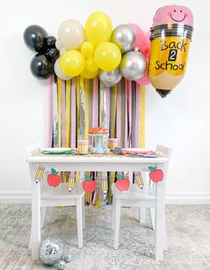 a birthday party with balloons and decorations