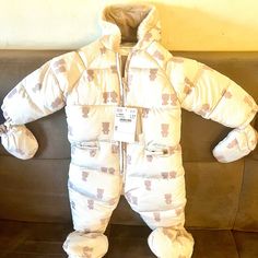 Unisex Snowsuit By Mayoral, With Teddy Bear Pattern. Thickly Padded And Has A Fixed Hood With Faux Fur Trim. It Has A Front Zip Fastening And A Soft Jersey Lining. The Mittens And Booties Are Removable And Secure With Buttons To The Elasticated Cuffs. Red Puffer Jacket, Girls Puffer Jacket, Baby Snowsuit, Winter Fur Coats, Red Puffer, Teddy Bear Pattern, Quilted Puffer Jacket, Baby Jacket, Kids Coats