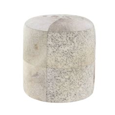 a white and black stool with spots on the top, sitting in front of a white background