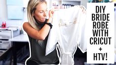 a woman holding up a white shirt with the words diy bride robe with cricut on it