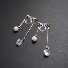 Double sided cz crystal clip on earrings, cubic zirconia, silver clip on earrings dangle, invisible clip on earrings, pearl clip on earrings 💖More pierced look and comfortable invisible clip on earrings are available at MiyabiGrace home page. Please click the link below https://www.etsy.com/shop/MiyabiGrace Details ◆Length:1.57 inches (4 cm) ◆Weight:1 g (0.04 oz) ◆Color: Gold ✨These are gorgeous double sided invisible clip on earrings. Pearls are attached to the front and cubic zirconia crystal Clip On Earrings Dangle, Dangly Clip On Earrings, Elegant Adjustable Clip-on Earrings, Silver Clip-on Pearl Jewelry, Elegant Adjustable Dangle Clip-on Earrings, Silver Pearl Clip-on Jewelry, Elegant Cubic Zirconia Clip-on Jewelry, Cubic Zirconia Clip-on Dangle Earrings, Elegant Dangle Clip-on Jewelry