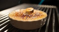 some food is cooking in an oven on top of the grill and it looks like something out of space