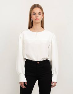 This silk crepe blouse with our signature puff sleeves and front key-hole detail is a must have in your wardrobe. It's an exclusive feminine staple pieces which you easily combine with all your skirts and trousers already hanging in your wardrobe. It's our most versatile piece and you can literally wear it during all occasions. This piece is crafted with love for detail and has fabric covered button closure in front as well on the puff sleeve cuffs. The back is longer than the front and the heml Formal Blouse With Bishop And Gathered Sleeves, Formal Top With Lantern Gathered Sleeves, Formal Tops With Blouson Bishop Sleeves, Fitted Blouse With Blouson Sleeves In Viscose, Chic Formal Blouse With Gathered Sleeves, Chic Silk Blouse With Bishop Sleeves, Classic Workwear Top With Balloon Sleeves, Classic Tops For Workwear With Balloon Sleeves, Versatile Viscose Blouse For Formal Occasions