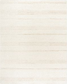 an area rug with white and beige stripes