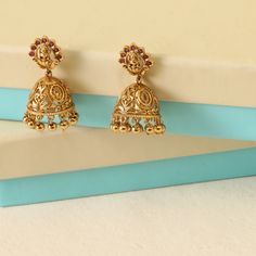 About the Jewelry Tiny Treasures! These antique jhumkis are crafted in beautiful floral intricate work. Our Utash earrings display a small goddess Lakshmi motif on the stud. These earrings are made of premium quality CZ stones and embellished with antique plated to deliver an elegant finish. Sometimes the smallest things are what we treasure. Styling Tip Looking something for everyday fashion or simple occasions? Style this with your tunics or dresses for a minimal look. Details & Specifications Antique Lakshmi Earrings, Jewelry Pics, Earrings Display, Buy Jewellery Online, Indian Jewellery Design, Traditional Earrings, Choker Pendant, Kundan Earrings, Goddess Lakshmi