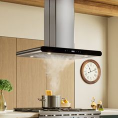 a kitchen with an oven, stove and clock on the wall next to it's counter