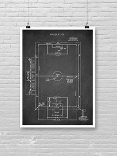 a black and white drawing of a soccer field on a brick wall with wires hanging from it