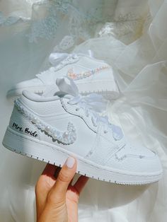 Bridal sneakers available sizes from 5W-8.5W These are all youth sneakers that has been converted to womens sizes These sneakers are uniquely designed for your special day What is included:  1.Pearls on the outter swoosh 2.Pearls on the lining of the sneakers 3.Name and Wedding Dates  we cannot take returns or exchanges. ALL SALES ARE FINAL Turn around time is about  a week. If you have any questions feel free to contact me I will try my best to help you with any request you have :) Custom Sneakers With Round Toe For Wedding, Custom Round Toe Sneakers For Wedding, Custom Wedding Sneakers With Round Toe, Custom White High-top Wedding Sneakers, Customizable White Sneakers For Wedding, Custom White Wedding Sneakers, Customizable White Wedding Sneakers, Custom Wedding Sneakers With Round Toe And Laces, Custom Low-top Sneakers For Wedding