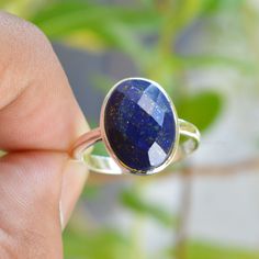 Lapis Lazuli Ring, Lapis Lazuli 10x14mm Oval Faceted Cut Gemstone, Lapis Ring, Lapis Lazuli Jewelry, Handmade Ring, Bezel Ring, Gift For Her ---------------------------------------------------------------------------------------------------------------------------------------------------- Metal: Solid 925 Sterling Silver Stone Detail : Natural Lapis Lazuli Size-10x14mm Shape-Oval Cut Stone ----------------------------------------------------------------------------------------------------------- Adjustable Oval Sapphire Ring, Oval Faceted Crystal Ring As Gift, Faceted Oval Crystal Ring As Gift, Faceted Oval Crystal Ring For Gift, Handmade Oval Sapphire Rings, Simple Silver Jewelry, Lapis Lazuli Jewelry, Lapis Ring, Ring Bezel