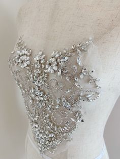 Rhinestone bead applique, crystal bodice patch, heavy bead handmade SIZE: 26cm at the widest point 25cm in height in central This stunning rhinestone applique is hand crafted, design with elegant florals. There is no iron on glue on the back, sew it to your dress . Suitable for bridal dress, evening dress and haute couture for special events, highly recommended for bridals and designers. SUPER LUXURY, HIGHLY RECOMMENDED! SIMILAR ITEMS: https://www.etsy.com/listing/1143786315/pale-blue-french-bea Embellished Wedding Dress With Fitted Bodice, Embellished Wedding Dress With Fitted Bodice And Sweetheart Neckline, Glamorous Embellished Wedding Dress With Sweetheart Neckline, Wedding Corset With Sequins And Fitted Bodice, Glamorous Embellished Wedding Dress With Fitted Bodice, Embellished Corset With Sweetheart Neckline, Glamorous Sequined Corset For Wedding, Glamorous Embellished Wedding Corset, Fitted Sequin Wedding Corset