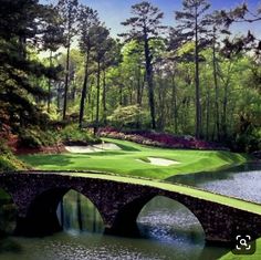 a bridge over a body of water near a golf course