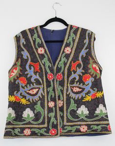 A rare find vintage sleeveless waistcoat from Afghanistan. Size: M Bust: 20.5 Inches Height: 24.5 Inches Note: Worn and minor signs of wear. Embroidered Festival Vest, Embroidered Sleeveless Vest For Festival, Bohemian Sleeveless Vest With Floral Embroidery, Sleeveless Bohemian Vest With Floral Embroidery, Fitted Vintage Vest With Embroidery, Vintage Embroidered Fitted Vest, Vintage Fitted Embroidered Vest, Bohemian Embroidered Sleeveless Vest, Fitted Multicolor Vintage Vest