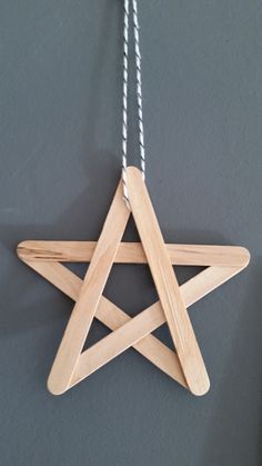 a wooden star hanging on a wall