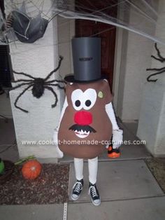 a person in a costume made to look like a man with a top hat and mustache