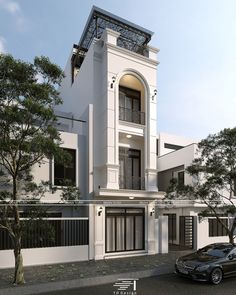 a black car parked in front of a white building with windows and balconies