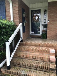 a front porch with steps leading up to the door