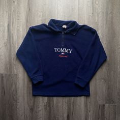 "Vintage 1990s Tommy Hilfiger Quarter Zip Navy Blue Sweatshirt - Size S (Length 24\" Chest 21\")  - Overall great vintage condition - Flaws pictured / zipper jams - Message for more information Please take note of the measurements listed as these are vintage clothes and may fit different than the tag size. Follow our page for more vintage clothing drops! DISCLAIMER: All items are vintage so please be mindful that if by chance there is a flaw on the item we simply may have just missed it. Inquire for more product information." 90s Tommy Hilfiger Outfit, 90s Style Winter Tops With Embroidered Logo, Tommy Hilfiger Plus Size, Vintage Fleece Tops For Winter, 90s Long Sleeve Tops With Embroidered Logo, Vintage Fleece Tops For Streetwear, Vintage Fleece Winter Tops, Tommy Hilfiger Sporty Sweatshirt For Streetwear, Tommy Hilfiger Vintage 90s