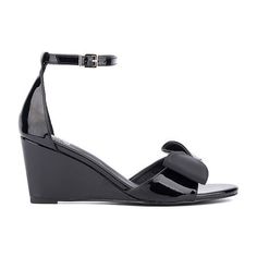 Textured bow details add a feminine twist to the shelby sandal, featuring a wedge heel. With a polished buckle closure on the ankle strap, it pairs perfectly with a sleek sheath dress. Closure Type: BuckleShoe Heel Height: 3 InchesUpper/Outer Base Material: 100% LeatherShoe Lining Material: LeatherSole Material Content: 100% RubberToe Type: Open Toe, Pointed ToeShoe Strap Type: Ankle StrapHeel Style: Wedge HeelCountry of Origin: Imported Chic Patent Leather Wedge Sandals For Summer, Summer Formal Patent Leather Wedge Sandals, Elegant Wedge Sandals With Buckle Closure And Round Toe, Formal Summer Patent Leather Wedge Sandals, Spring Formal Patent Leather Wedge Sandals, Patent Leather Wedge Sandals For Spring Evening, Patent Leather Wedge Sandals For Evening, Elegant Wedge Sandals With Buckle Closure For Spring, Elegant Spring Wedge Sandals With Buckle Closure