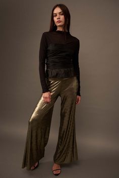 Shimmery metallic knit pants. Wide leg. Wide waistband. Pull-on closure. High waist. Relaxed fit. 95% Polyester, 5% Spandex. Imported. Designed in LA. Model wears size S. Metallic Pants, Wide Leg Palazzo Pants, Metallic Knit, Gold Fabric, Flared Pants, Knit Pants, Palazzo Pants, Wide Waistband, Dress Romper