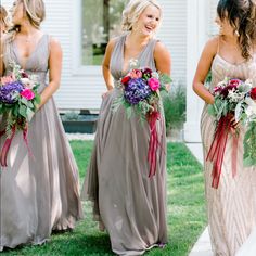 the bridesmaids are all wearing different colored dresses