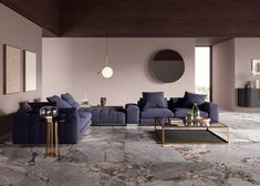 a modern living room with marble flooring and purple couches, coffee table and round mirror on the wall