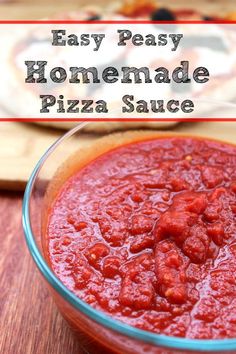 homemade pizza sauce in a glass bowl on a wooden table with the words easy peasy homemade pizza sauce