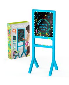 a kid's easel with a chalkboard in front of it and a box