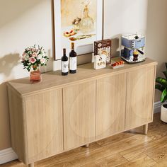 a wooden cabinet with wine bottles and flowers on top