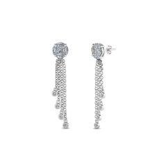 The Tassel Diamond Dangle Earring has an alluring charm with the marvelous princess and marquise cut diamonds held together in a classic prong setting forming a circle. Further accentuating the gorgeous earring are tiny dazzling round shaped stones dangling from the polished metallic chains in a stunning bezel setting for added grace and splendor.  Round, princess and marquise cut diamonds of 1.26 Total Carat Weight with Clarity SI2 and Color G in a prong and bezel setting. Total Number of Luxury Single Diamond Dangle Earrings, Luxury White Danglers With Tilla Detail, White Diamond Cut Dangle Jewelry, Diamond White Single Dangle Earring, White Platinum Dangle Diamond Earrings, Diamond White Dangle Earrings, Pierced, Club Earrings, Halo Diamond Earrings, Round Pattern