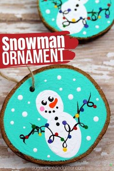 snowman ornament made out of wood slices on a wooden table with text overlay