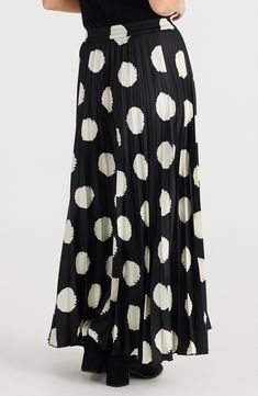 Accordion pleats and playful polka dots make this sweeping skirt an instant standout style. 38" length (size Medium) Elastic waist Unlined 100% polyester Hand wash, line dry Imported Chic Polka Dot Relaxed Skirt, Chic Polka Dot Relaxed Fit Skirt, Chic Polka Dot Skirt Relaxed Fit, Flowy Polka Dot Midi Skirt, Polka Dot Relaxed Midi Skirt, Polka Dot Flowy Lined Skirt, Relaxed Fit Polka Dot Skirt, Polka Dot Pleated Skirt For Spring, Elegant Polka Dot Flowy Skirt Bottoms