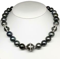 Diamond Tahitian Pearl Necklace 14k Gold 17.5 mm 17.5" Certified $29,750 915540 This fine piece of jewelry is designed by Ezra Kassin! DETAILS Number of Pearls: 30 Fine Quality Tahitian Black Pearls LARGE 17.50-13.26 MM Quality Grade: AA (High) Color: Black Surface: Lightly Blemished Luster: High 17.5 Inches 92 Diamonds VS-SI 14 KT SOLID WHITE GOLD MOUNTING & CLASP. This is an elegant addition to any outfit and would be a wonderful addition to any jewelry collection that will be cherished fo Akoya Pearl Earrings, Diamonds And Pearls, Tahitian Pearl Necklace, Pearl And Diamond Necklace, Black Pearls, Tahitian Black Pearls, Gold Pearl Necklace, Jewelry Show, Akoya Pearls