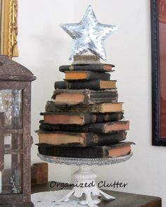 a stack of books sitting on top of a table next to a star shaped object