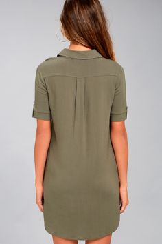 Your punctuation is on point, and so is your outfit, thanks to the Lulus Oxford Comma Olive Green Shirt Dress! Lightweight fabric constructs this woven shirt dress with a collared neckline, short sleeves (with button tabs), and front patch pockets. Full button placket. Hidden side seam pockets. Fit: This garment fits true to size. Length: Mid-thigh. Size medium measures 34.5" from shoulder to hem. Bust: Great for any cup size. Waist: Not Fitted - comfortable room throughout midsection. Hip: Not Semi-formal Collared Blouse With Placket, V-neck Shirt Dress With Placket For Daywear, Casual V-neck Shirt Dress With Placket, Spring Collared Shirt Dress With Roll-up Sleeves, Summer Collared Shift Shirt Dress, Summer Shift Shirt Dress With Short Sleeves, Collared Neckline Shirt Dress For Work, Fitted Polo Dress For Work With Collared Neckline, Short Sleeve Shirt Dress With Button Closure For Summer