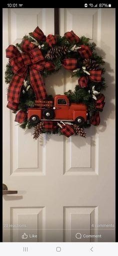 a red truck wreath hanging on the front door