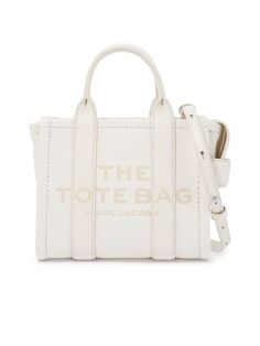 * Colour: White
   
 * Composition: 100% cow leather
   
   
   
 * Year: 2024
   
   
   
 * Made in: Vietnam
   
   
   
 * Style ID: 242445ABS000006-140
   
   
   
 * Measurements:
   Width: 18cm x Height: 15cm x Depth: 9cm
   Shoulder strap length: 115cm
   Handle drop: 8cm
   
   
   

A quintessential accessory for the modern woman, this Leather Mini Tote Bag
exudes urban chic. Meticulously crafted with grained leather, the tote makes a
statement with its bold contrasting logo. The design is practical yet stylish,
featuring double handles paired with a detachable and adjustable shoulder strap
for versatile carrying options. A side handle and top zipper closure ensure ease
of access, while the unlined interior and sleek silver-tone metalware add an air
of sophistication. It's an idea Lettering Logo, Dion Lee, Mini Tote Bag, Marc Jacobs Bag, The Tote Bag, Strap Top, Mini Tote, Sergio Rossi, Dolce & Gabbana