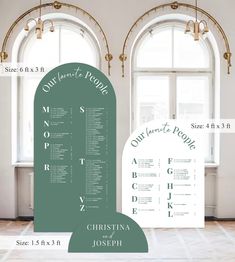 the wedding seating plan is displayed in front of two arched windows