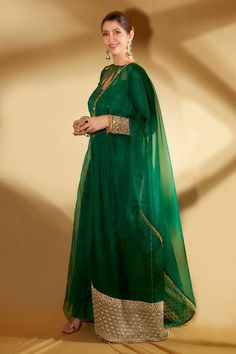 Green asymmetrical sheer anarkali with gold cord, beads, mirror embroidery and cutwork on bodice. Paired with pant and dupatta.
Components: 3
Pattern: Embroidery
Type Of Work: Floral
Neckline: Round
Sleeve Type: Full
Fabric: Organza and Spun Silk
Color: Green
Other Details: 
Cutwork detailing
Tassel border dupatta
Note: The inner worn by the model is not for sale
Occasion: Puja - Aza Fashions Cotton Suit Designs, Pakistani Party Wear Dresses, Mirror Embroidery, Designer Outfit, Pakistani Party Wear, Latest Bridal Dresses, Western Wear Outfits, Pakistani Fancy Dresses, Beautiful Pakistani Dresses