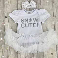 Baby Girl's Snow Cute tutu romper White tutu romper with matching bow headband Silver glitter lettering saying 'Snow Cute' (the o being a snowflake) A cute Christmasy themed outfit for your little girl Any questions or queries please just message me :) Want to know a bit about who's making your gifts.... We are an award winning family business in the heart of Lancashire. Little Secrets is a British family company, home to the most adorable baby girl and boy outfits and personalised gifts for all Cute Fitted Christmas Tutu Dress, Cute Fitted Tutu Dress For Christmas, White Christmas Tutu Dress For Party, Cute Christmas Tutu Dress, White Christmas Party Tutu Dress, White Fitted Christmas Tutu Dress, White Fitted Tutu Dress For Christmas, Cute White Bodysuit For Winter, Boys Birthday Outfits