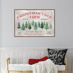 a christmas tree farm sign hanging above a bed