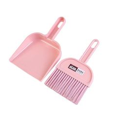 a pink dustpan and brush are shown with measurements