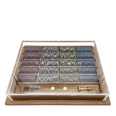 a wooden case with many different types of numbers in it and a key on the side