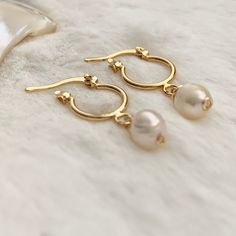 Excited to share this item from my #etsy shop: Tiny gold hoops, Pearl hoop earrings gold, Dainty hoop earrings, jr bridesmaid gift, huggie hoop earrings gold, delicate bridal earrings. #gold #wedding #circle #lovefriendship #pearl #shell #latchback #minimalist #hoops #minihoops #freshwaterpearls #bridesmaid #bridetobe Delicate Gold Huggie Earrings With Ear Wire, Gold 14k Gold Filled Huggie Earrings With Pearl Drop, Gold Minimalist Huggie Earrings With Pearl Drop, Gold Small Hoop Pearl Earrings For Everyday, Gold Small Hoop Bridal Earrings Gift, Gold Small Hoop Bridal Earrings, Delicate Gold Hoop Earrings For Wedding, Dainty Gold Hoop Pearl Earrings, Minimalist 14k Gold Filled Small Hoop Pearl Earrings